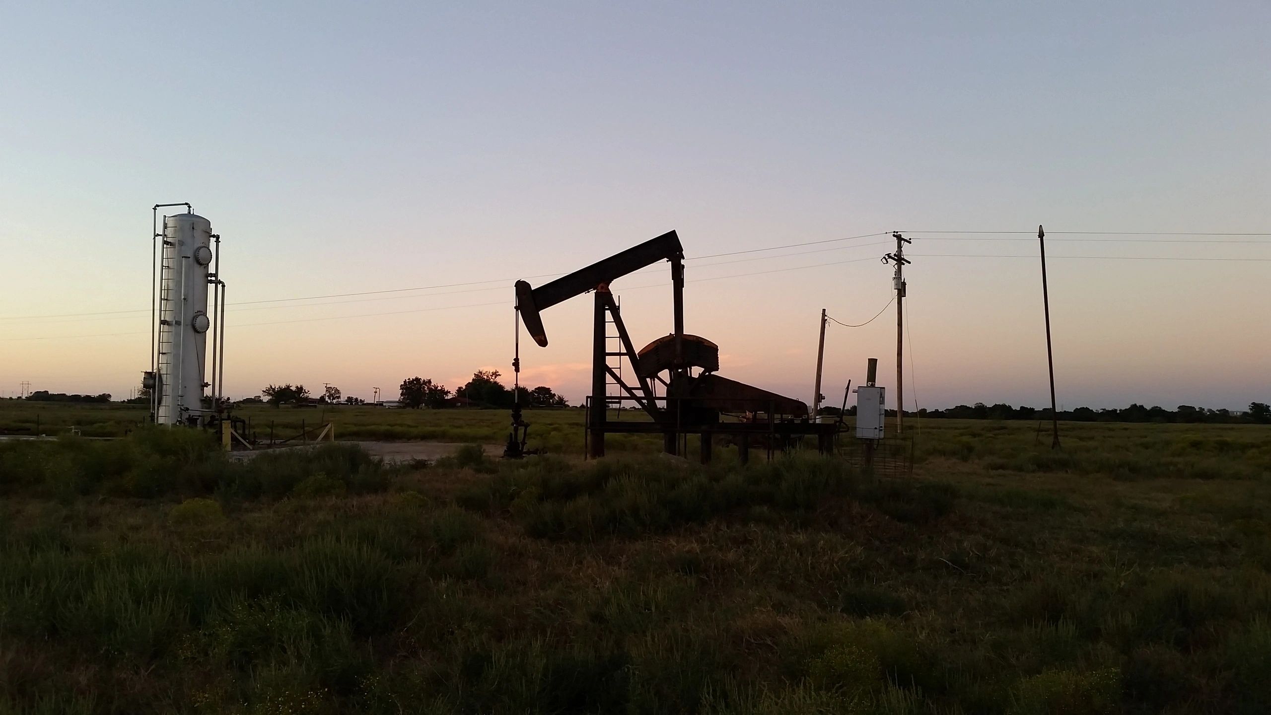 Oil field at dusk golden hour